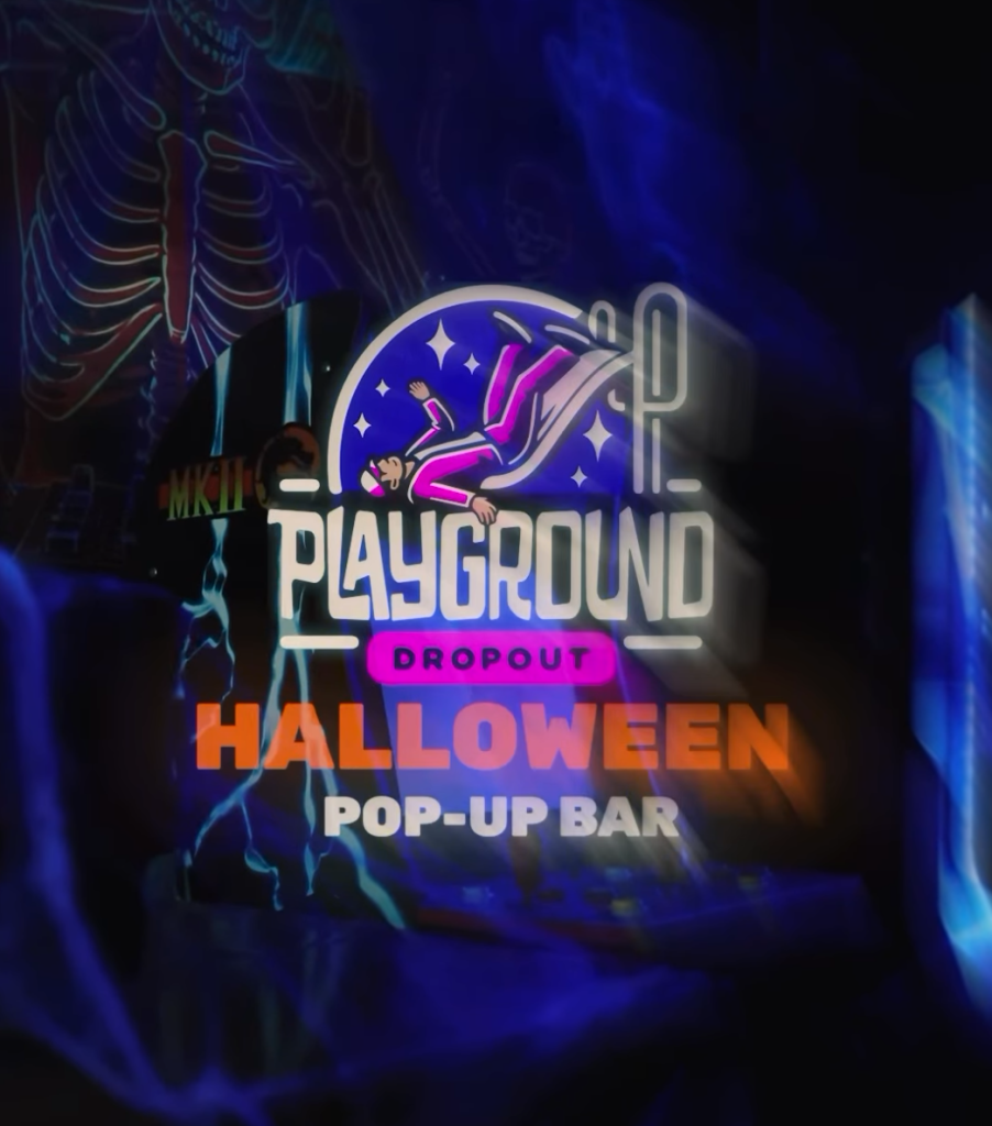Playground Dropout Halloween Pop-Up Bar logo glowing over neon skeleton decor